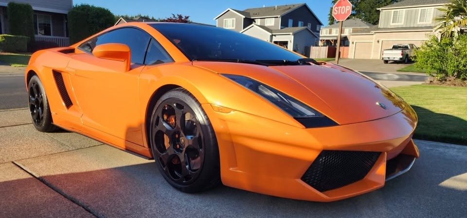 Orange Lamborghini after hood repair and refinishing by Revolutionary Auto Works